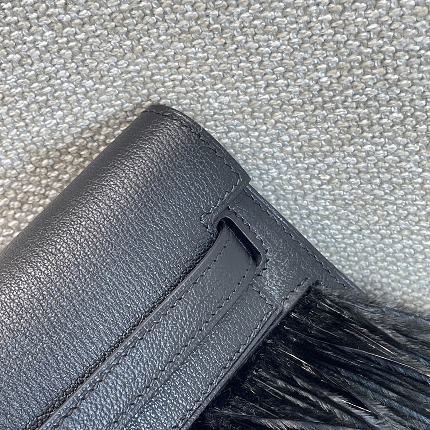 Hermès Model: Kelly Elan Feather Color: Black with Silver Buckle Dimensions: 27.5cm x 15cm x 5cm