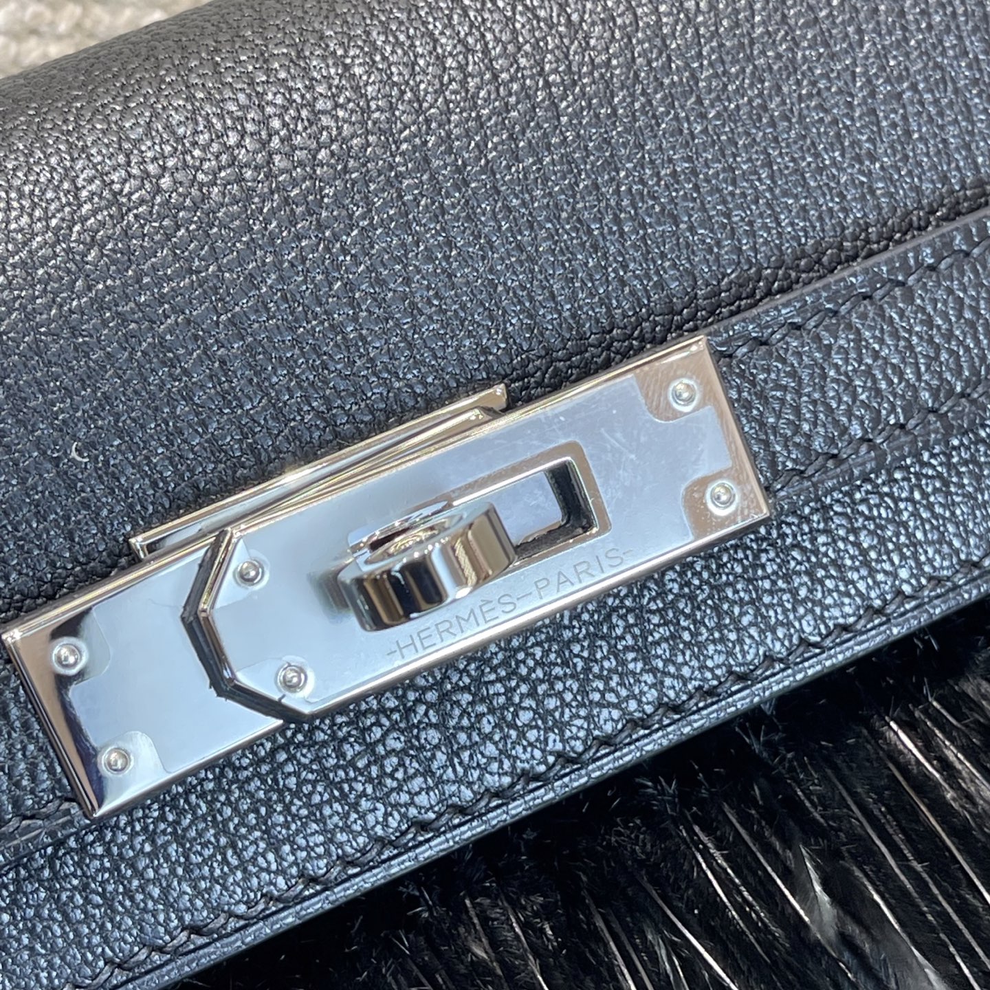 Hermès Model: Kelly Elan Feather Color: Black with Silver Buckle Dimensions: 27.5cm x 15cm x 5cm