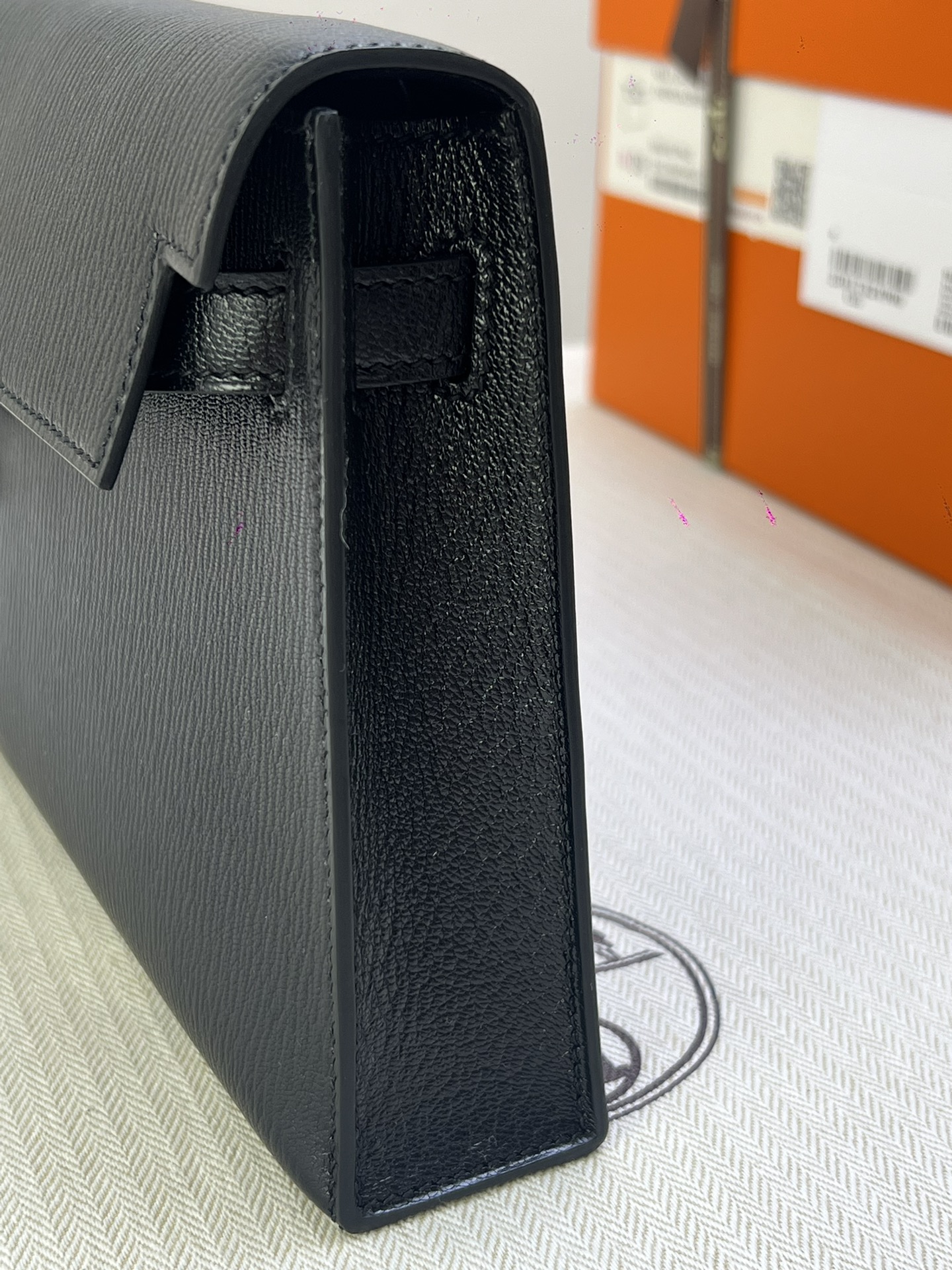 Hermès Model: Kelly Elan Color: Black with gold hardware Dimensions: 27.5cm x 15cm x 5cm