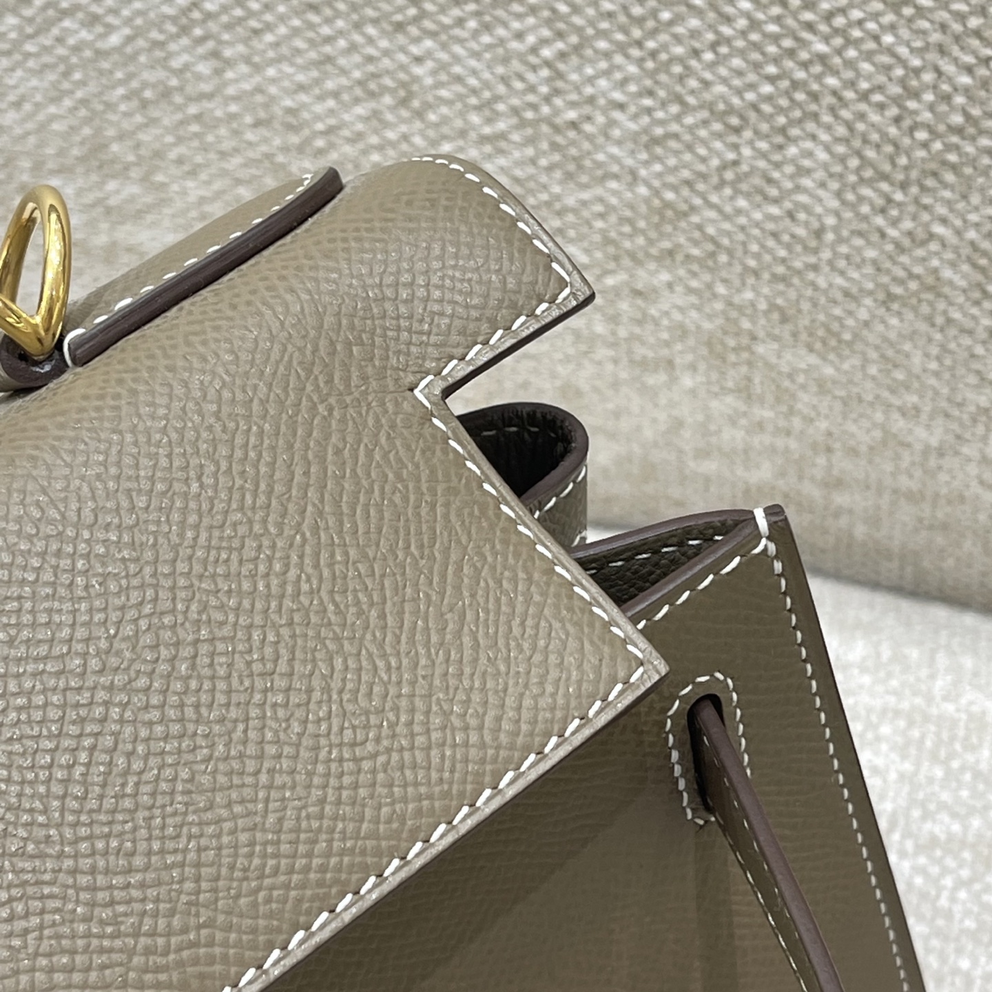 Hermès Model: Kelly 28 (Exterior Stitching) Color: Elephant Gray with Gold Hardware Dimensions: 28cm x 22cm x 10cm (including handles)