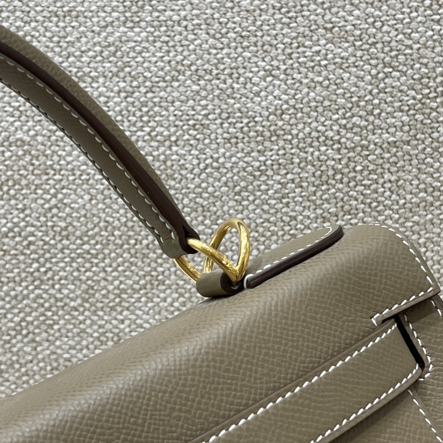 Hermès Model: Kelly 28 (Exterior Stitching) Color: Elephant Gray with Gold Hardware Dimensions: 28cm x 22cm x 10cm (including handles)