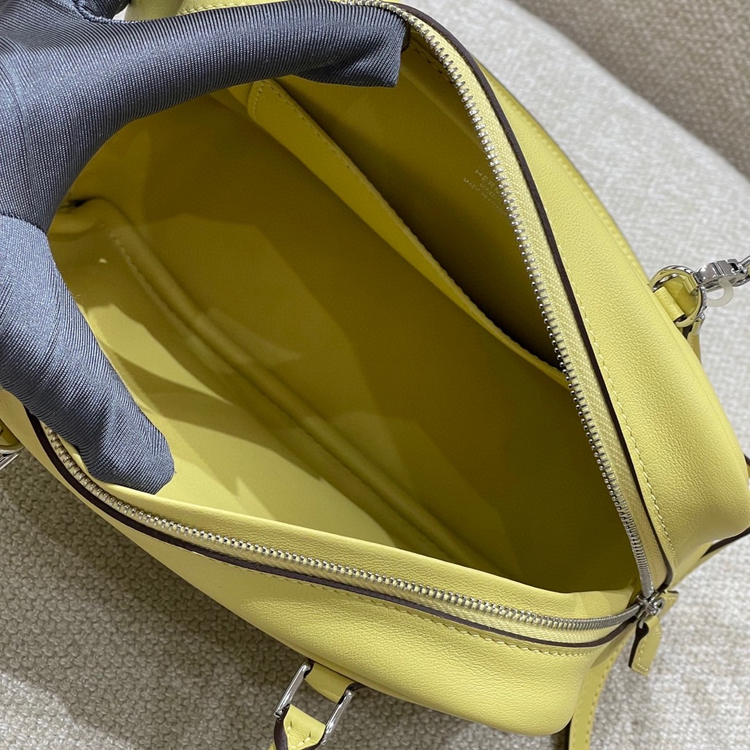 Hermès Model: Mini Plume Color: Chick Yellow Dimensions: 21cm x 15cm x 7.5cm