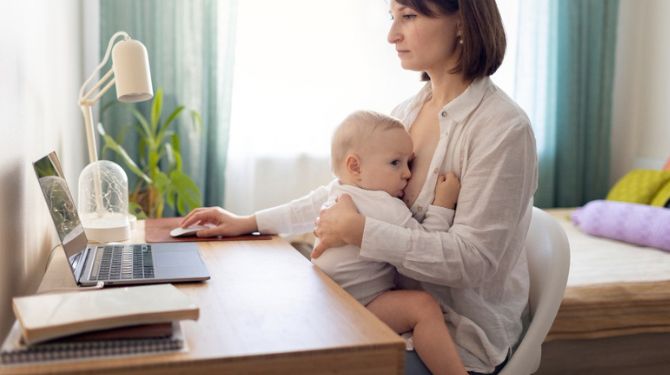Working mum breastfeeding her baby, representing breastfeeding in Malaysia