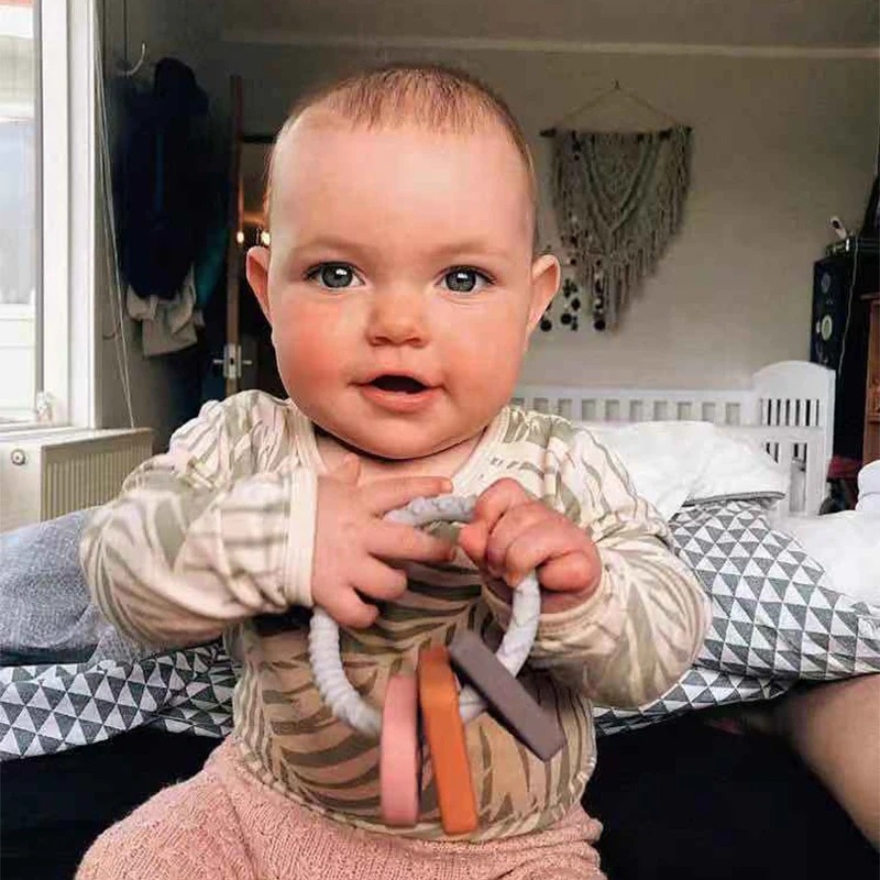 haakaa silicone teething ring teether helps develop fine motor skills
