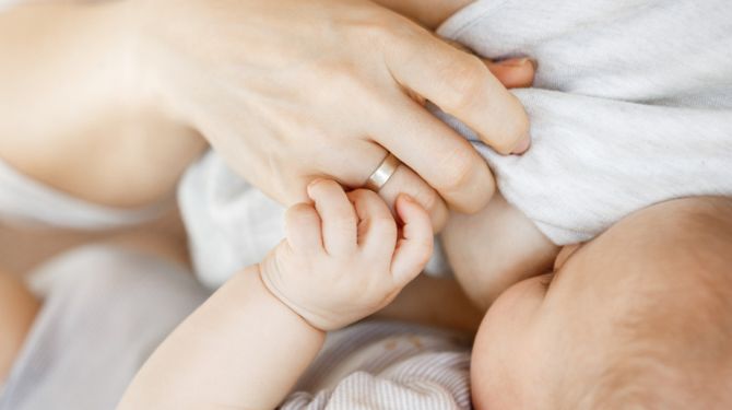 Photo of a woman breastfeeding her baby