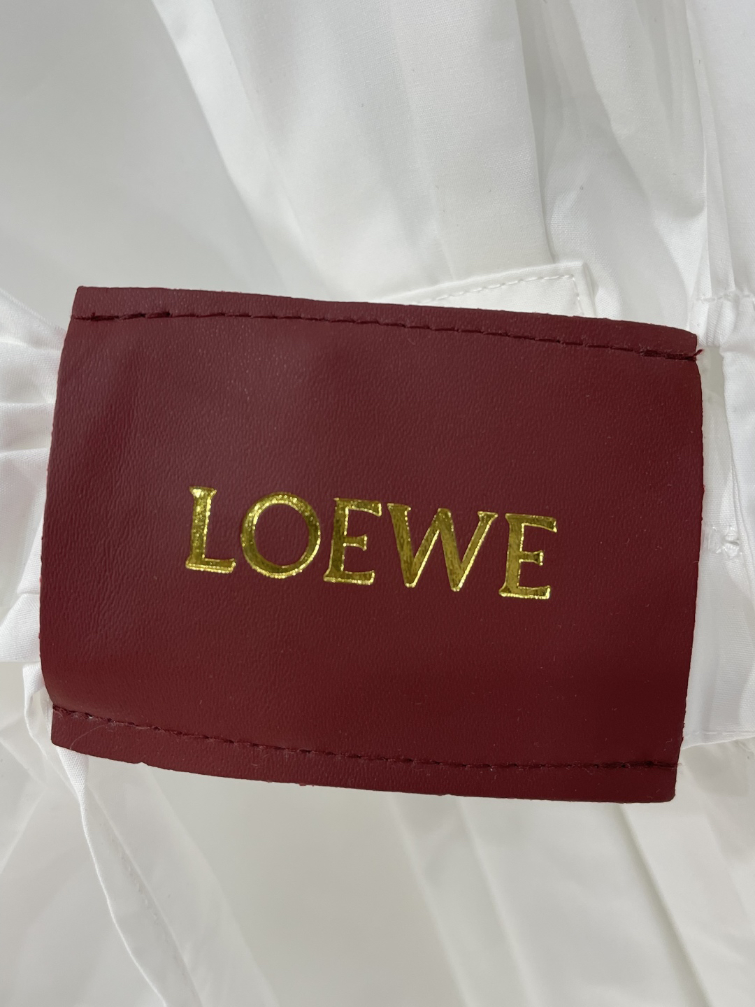 LOE monogrammed embroidered leather label long sleeve shirt