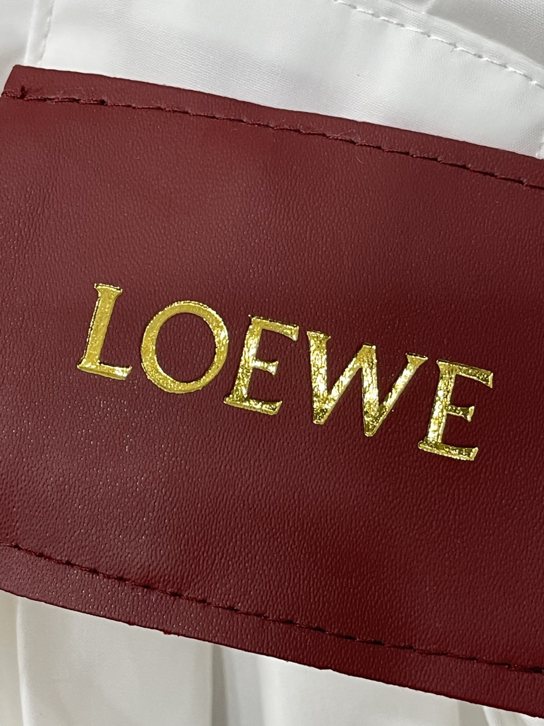 LOE monogrammed embroidered leather label long sleeve shirt