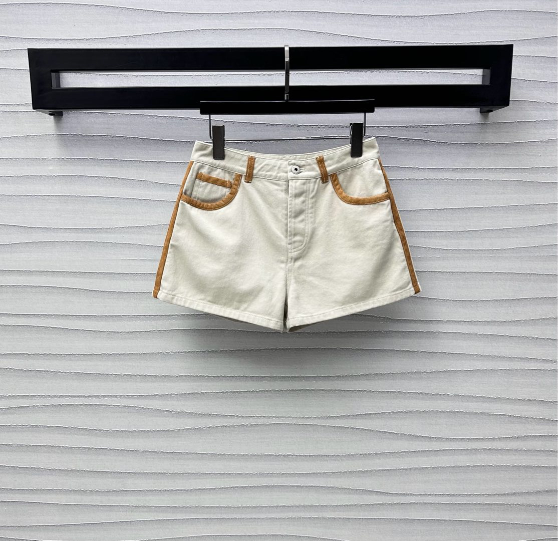 MIU25SS wrap-around patchwork denim shorts