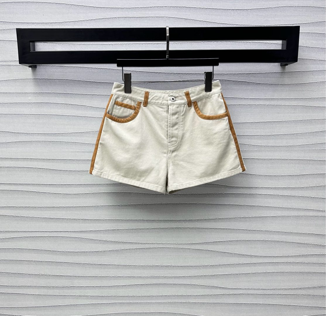 MIU25SS wrap-around patchwork denim shorts