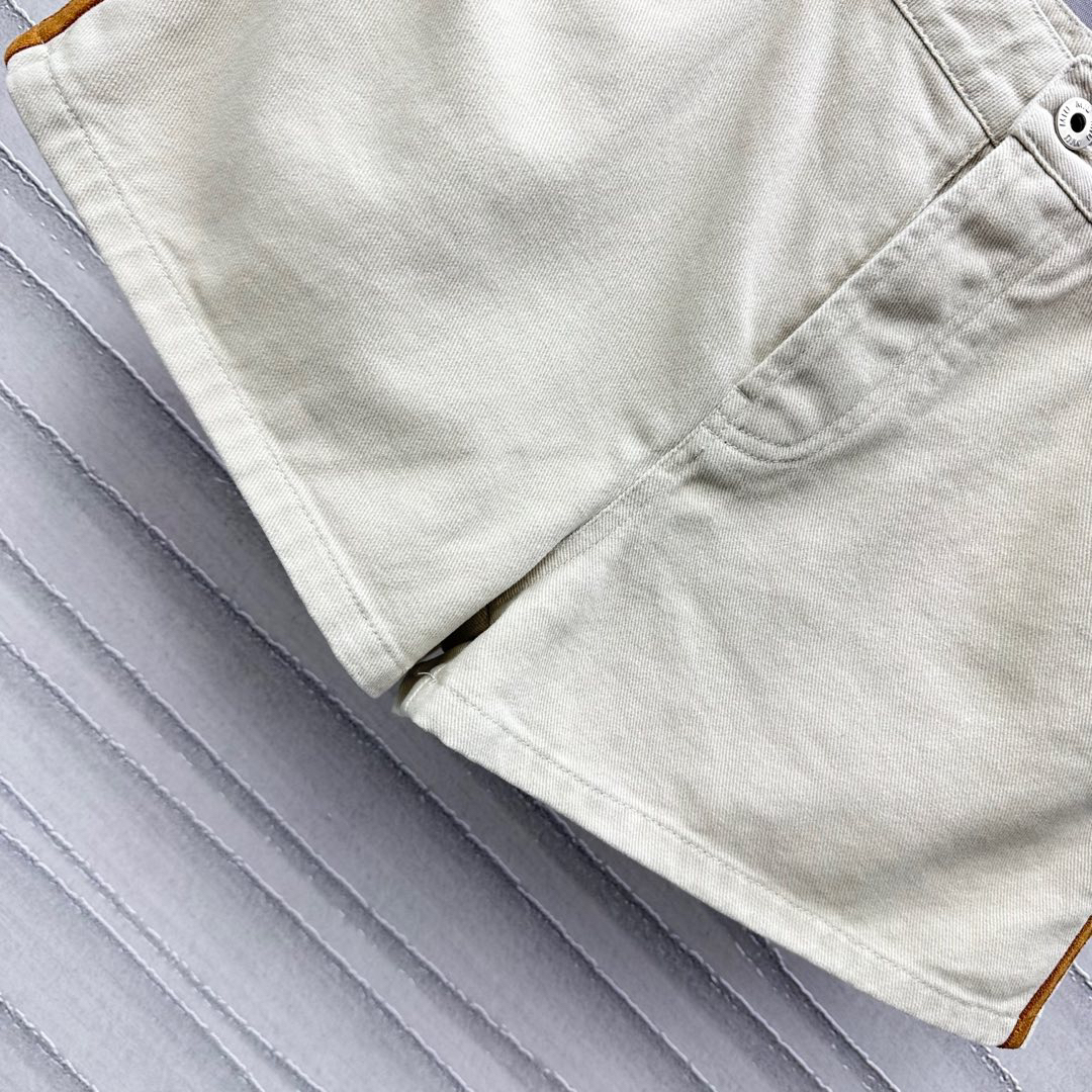 MIU25SS wrap-around patchwork denim shorts