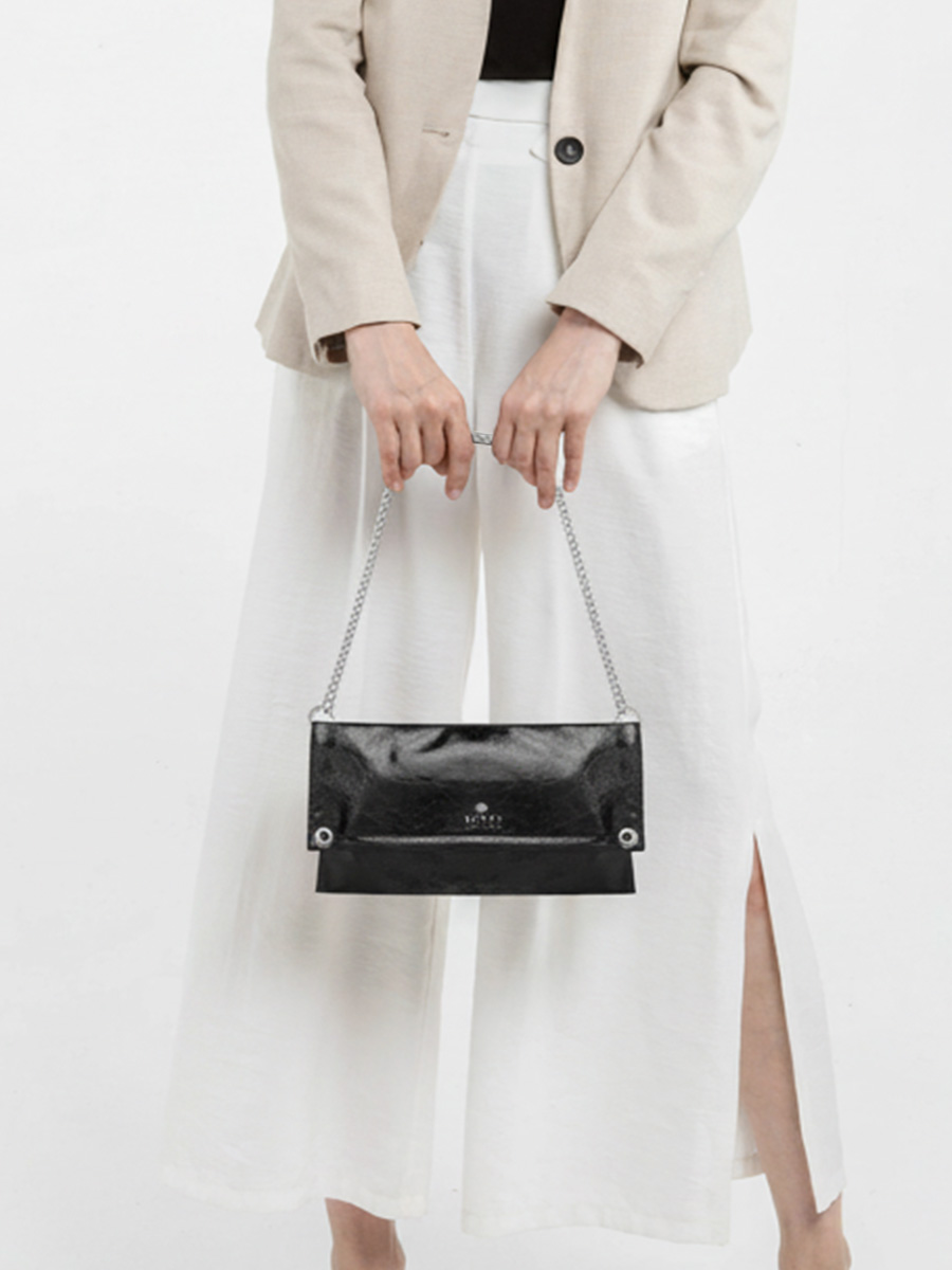Black oil-waxed leather bag with silver chain