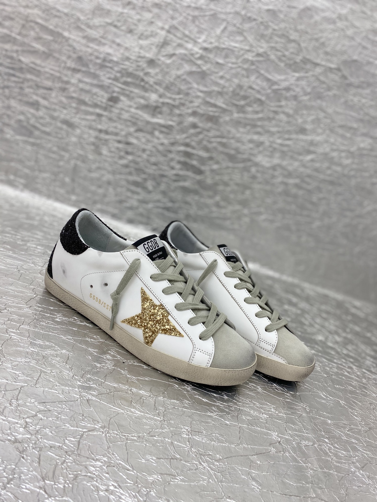 Golden Goose Super-Star in nappa leather with gold glitter star and black glitter heel tab
