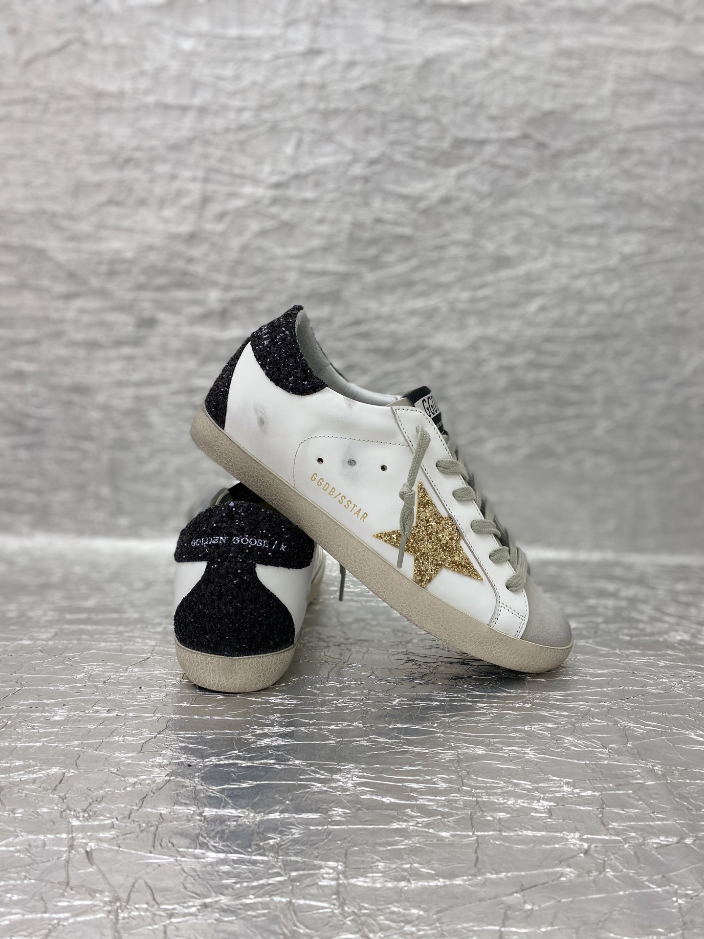 Golden Goose Super-Star in nappa leather with gold glitter star and black glitter heel tab
