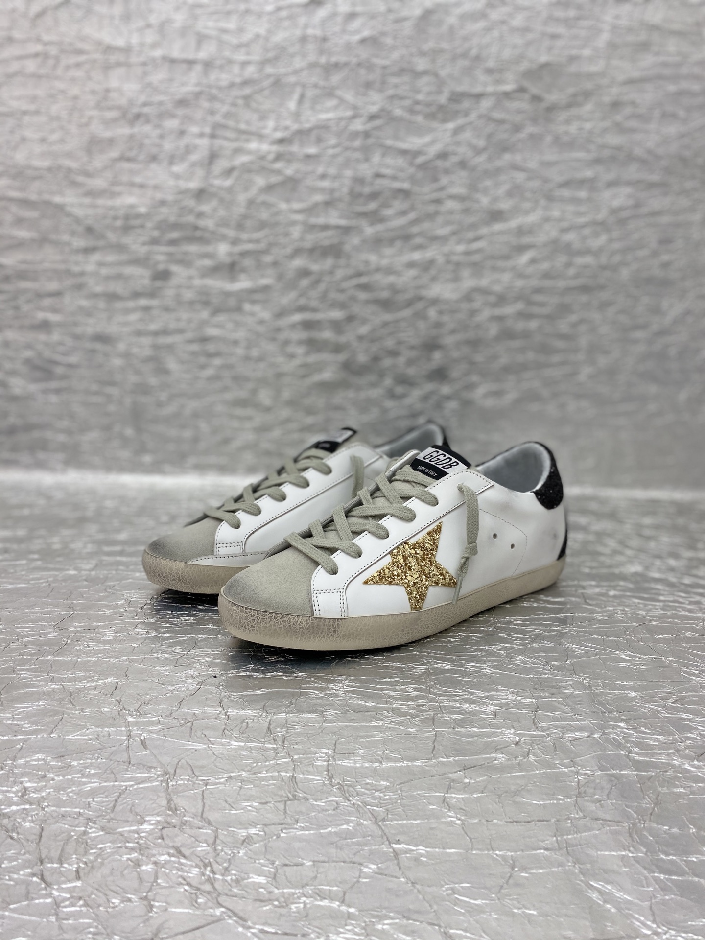 Golden Goose Super-Star in nappa leather with gold glitter star and black glitter heel tab