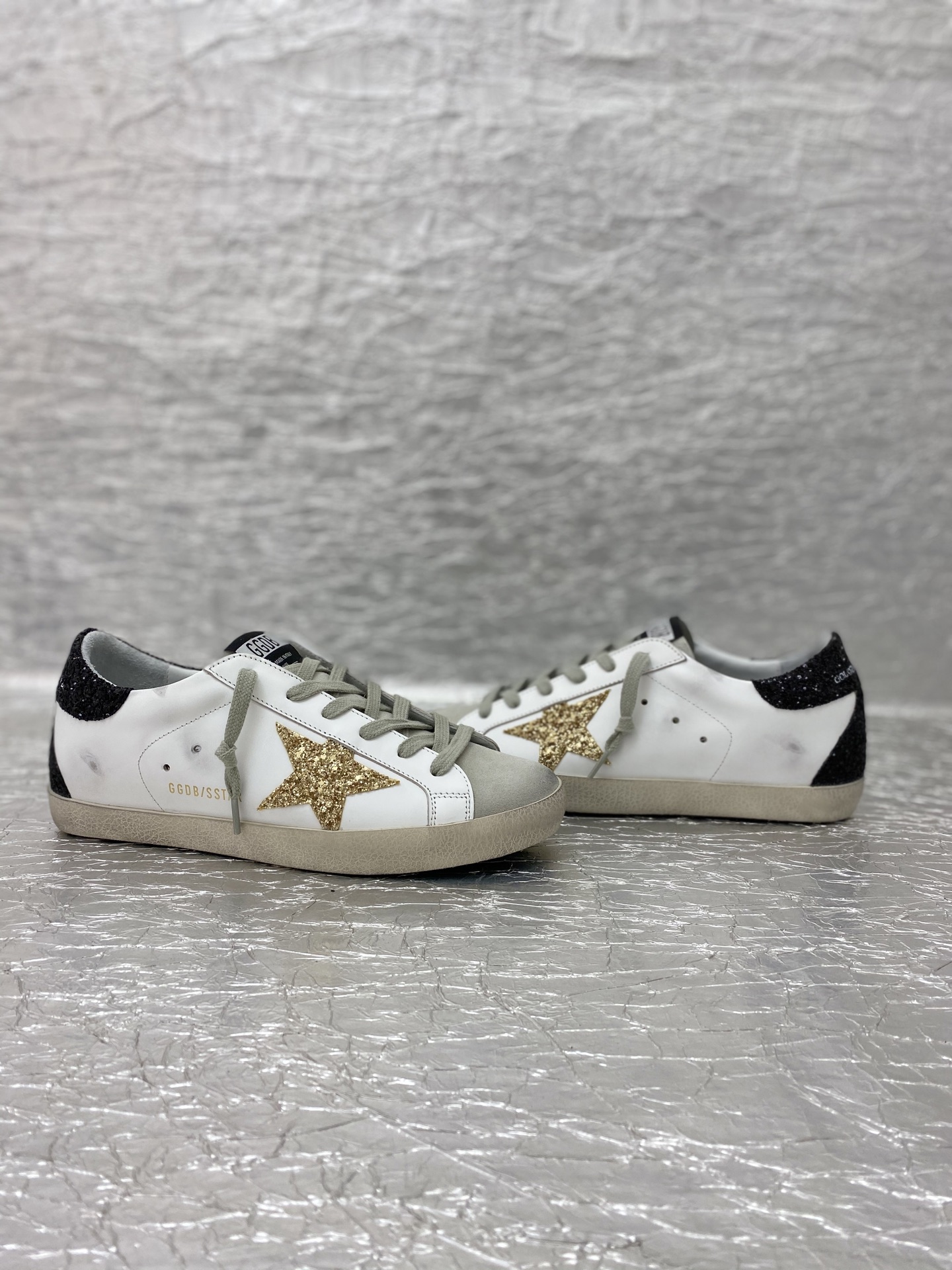 Golden Goose Super-Star in nappa leather with gold glitter star and black glitter heel tab