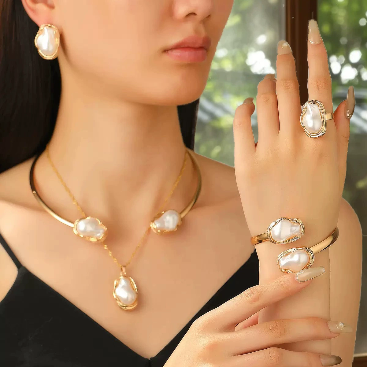 Five-piece set of gold necklace, collar, bracelet, ring, and earrings.