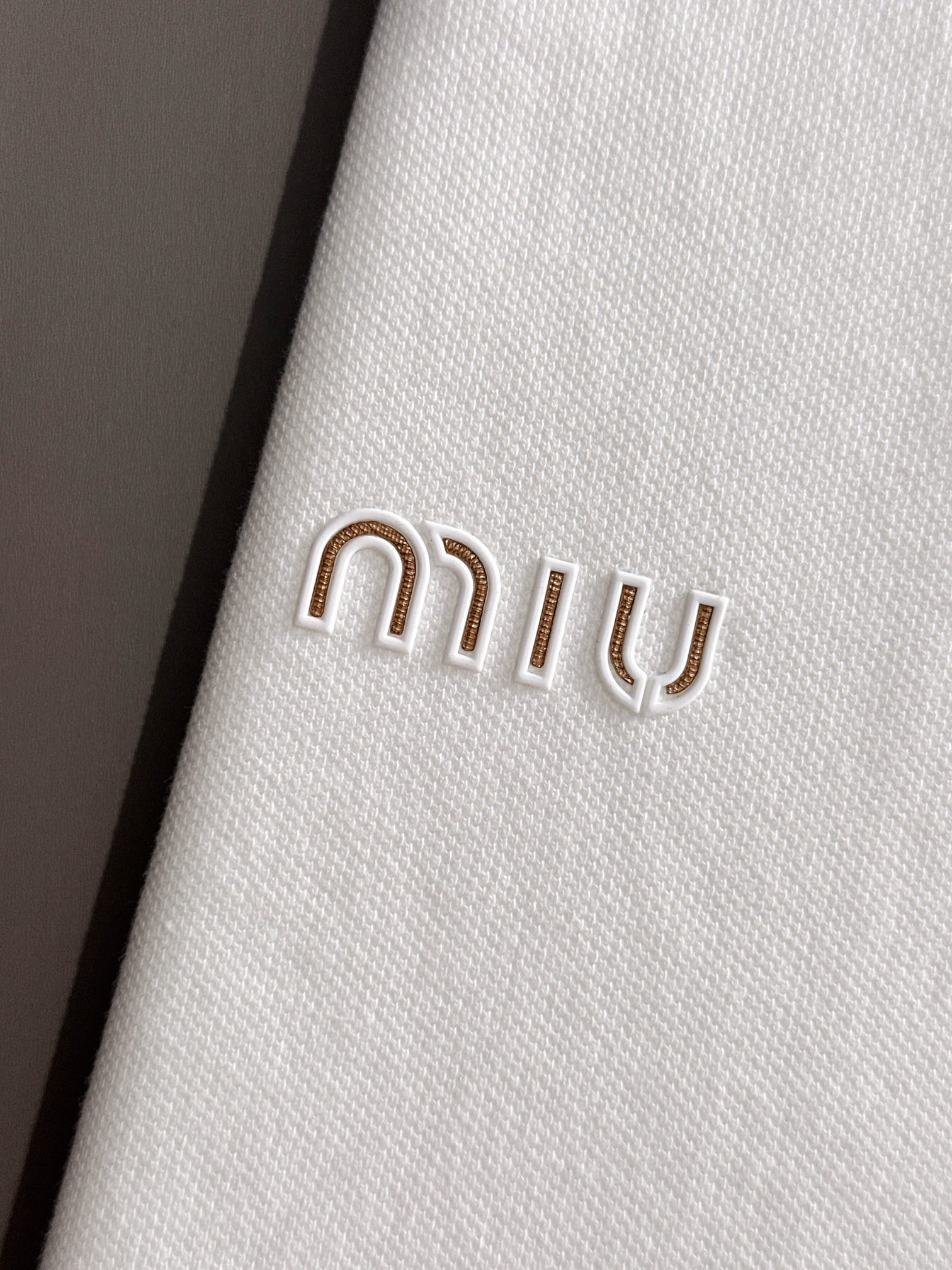 MIU MIU 2025年春夏新作　ネイビー/ホワイト ポロシャツ 半袖 T138063