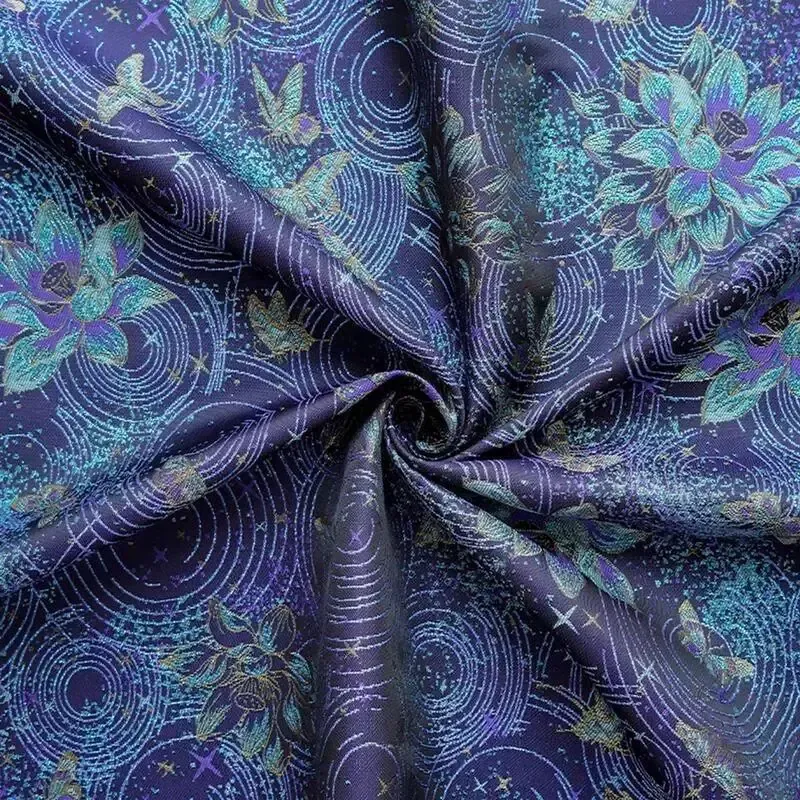 Blue and purple celestial orchid embroidered fabric with star and ripple pattern