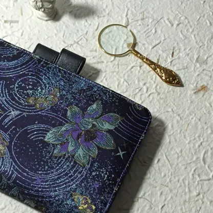 Close-up of celestial orchid fabric planner cover with a gold magnifying glass