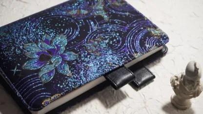 Celestial orchid embroidered Hobonichi planner cover with a blue and purple starry pattern