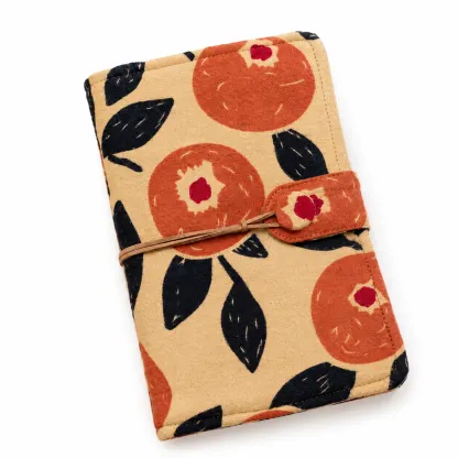 Floral fruit fabric savings binder cover with vintage cord closure on white background