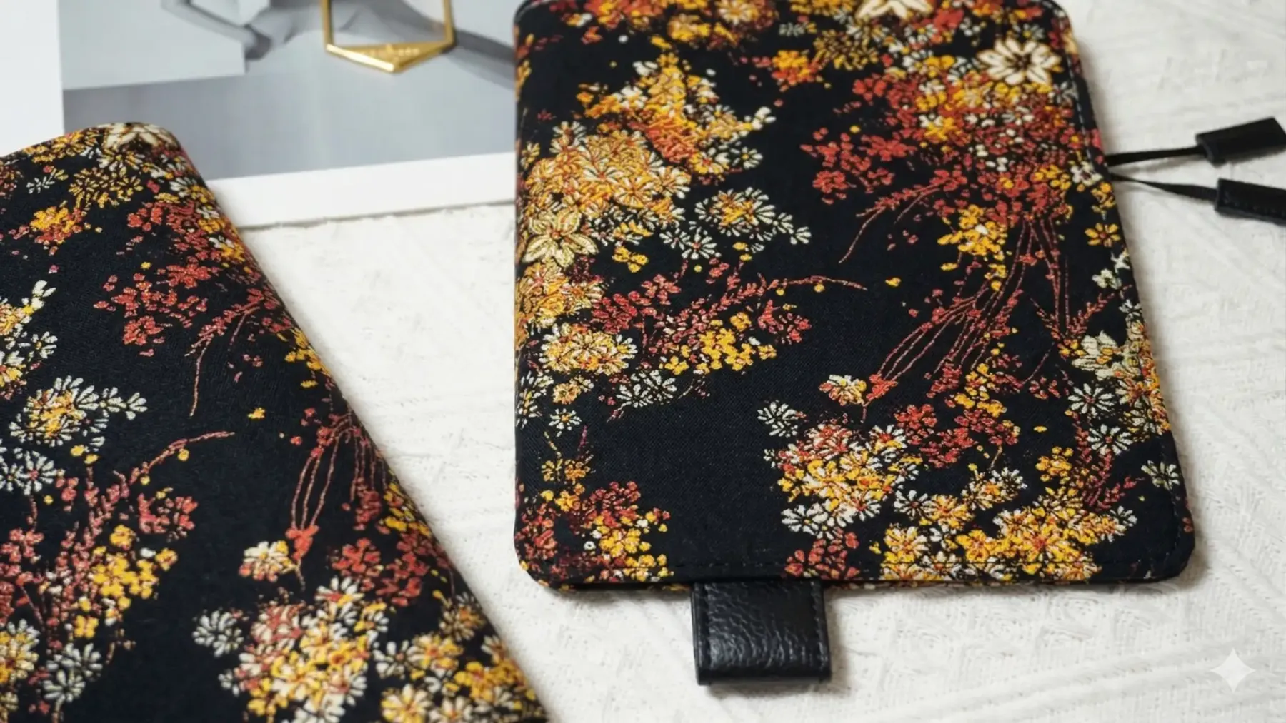 Close-up detail of the intricate wildflower embroidery on a deep navy base. This versatile design is compatible with both A5 and A6 size inserts, showcasing the artisan craftsmanship of ABIGALECrafts.
