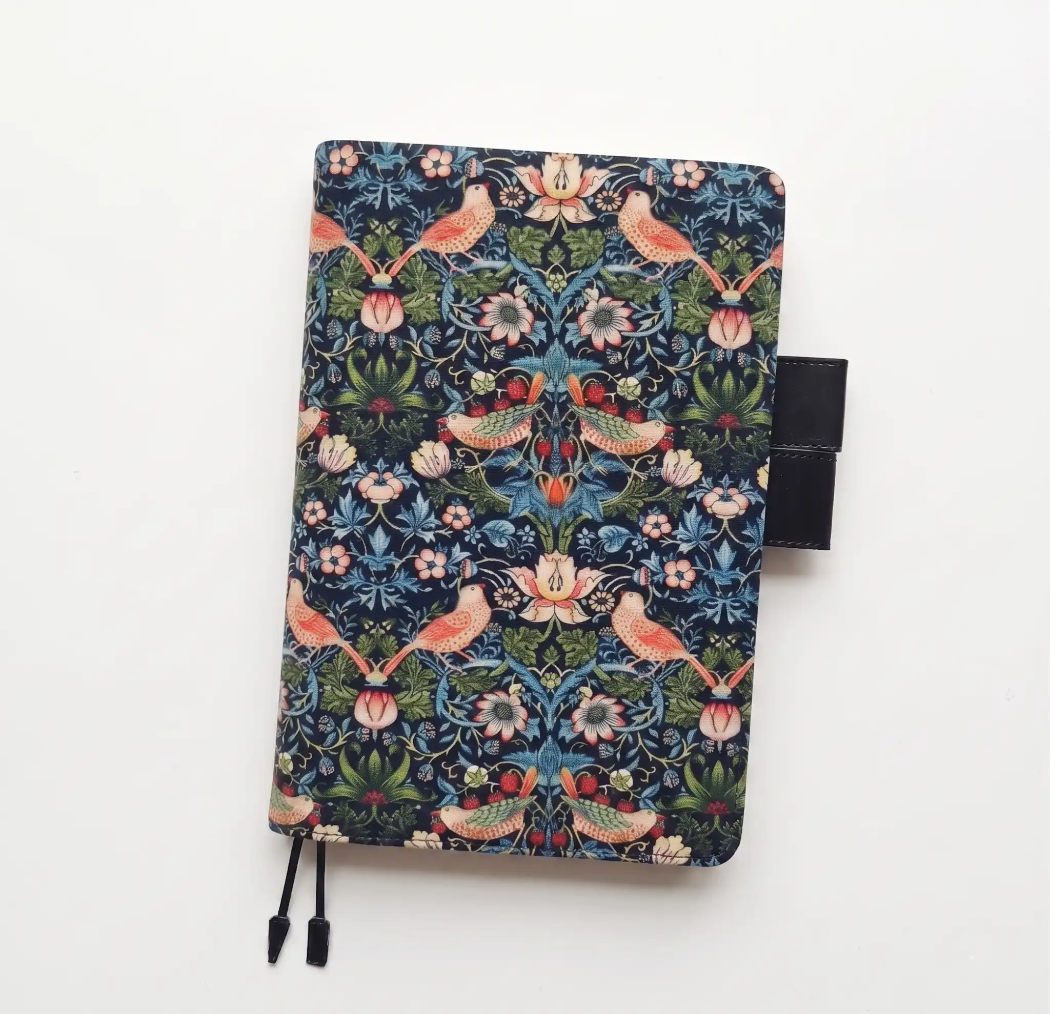 Clean product photography of a William Morris pattern planner cover compatible with Hobonichi A5 on a white background.