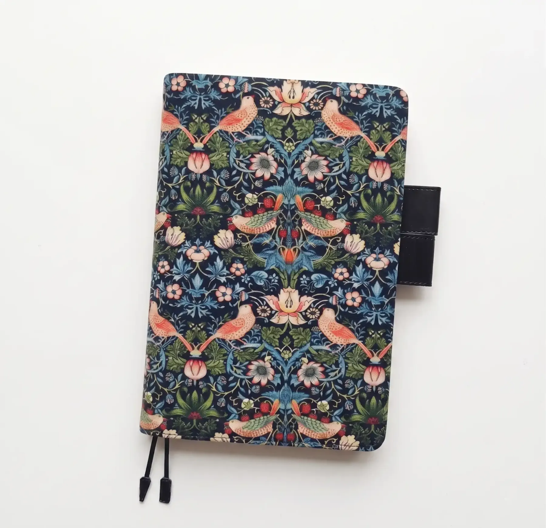 Clean product photography of a William Morris pattern planner cover compatible with Hobonichi A5 on a white background.