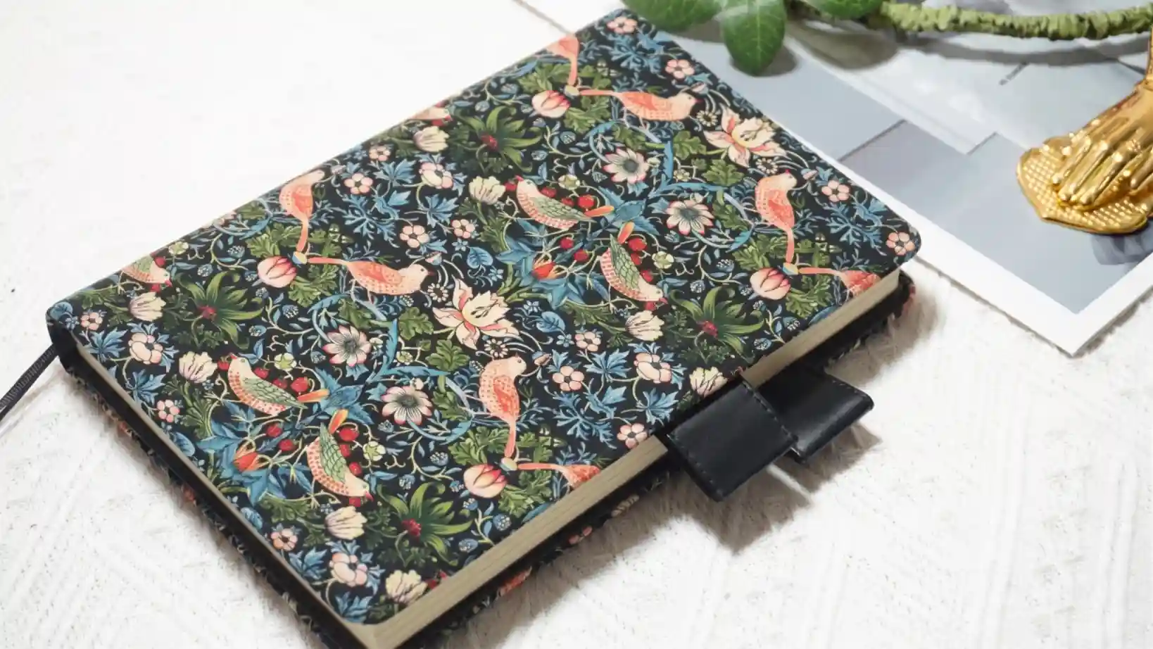 Horizontal view of the Strawberry Thief textile cover that fits Hobonichi A5 and A6 planners perfectly.