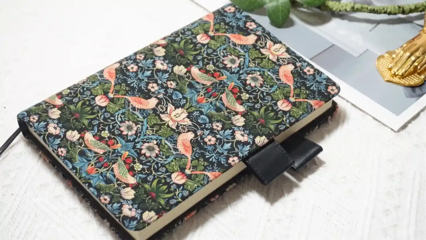 Horizontal view of the Strawberry Thief textile cover that fits Hobonichi A5 and A6 planners perfectly.