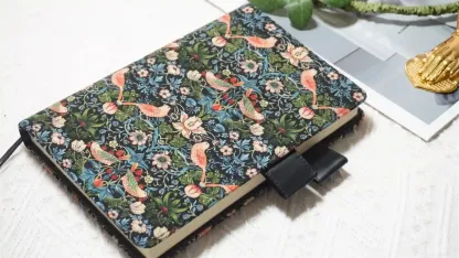 Close-up of woven fabric texture and butterfly pen loops on Hobonichi-compatible planner cover