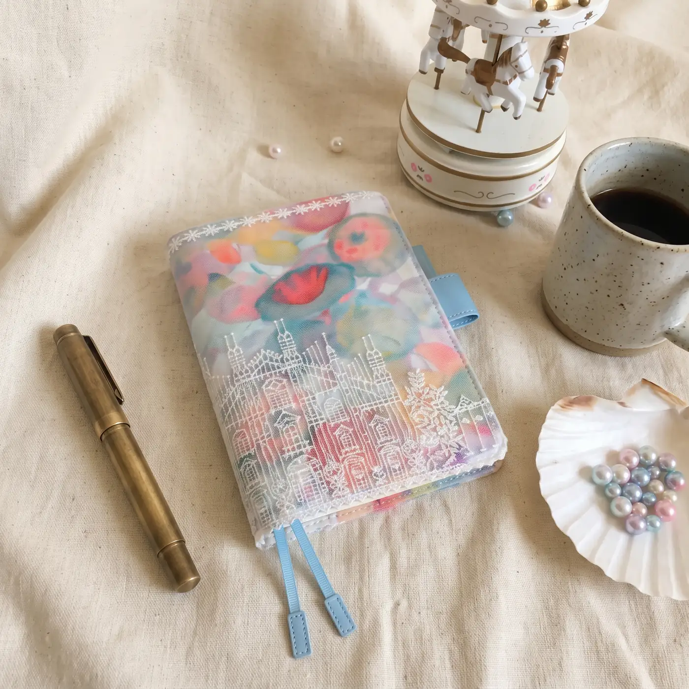 Portrait view of pastel floral castle embroidered planner cover