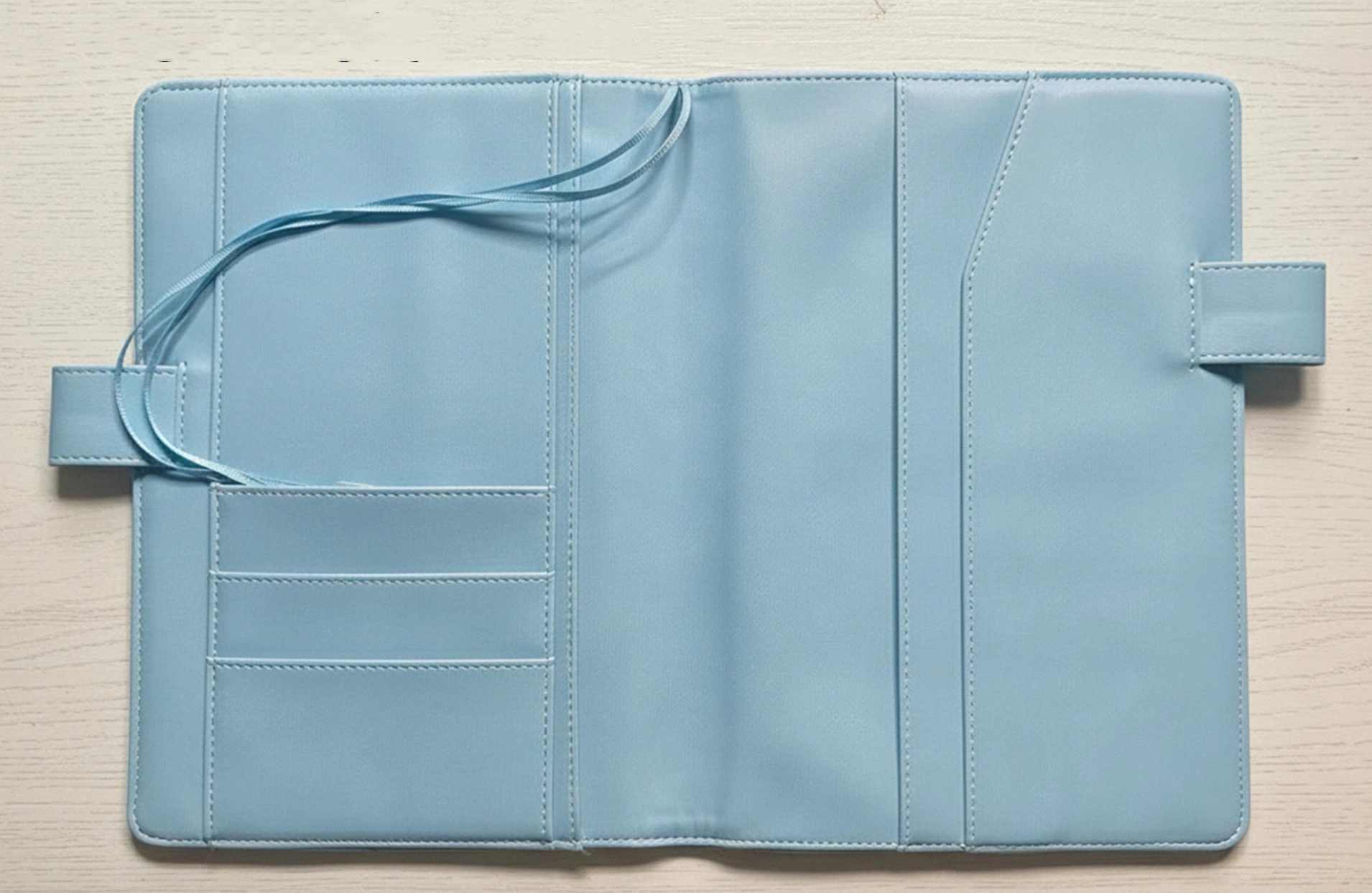 interior of handmade fabric planner cover  with card slots and pocket on white background