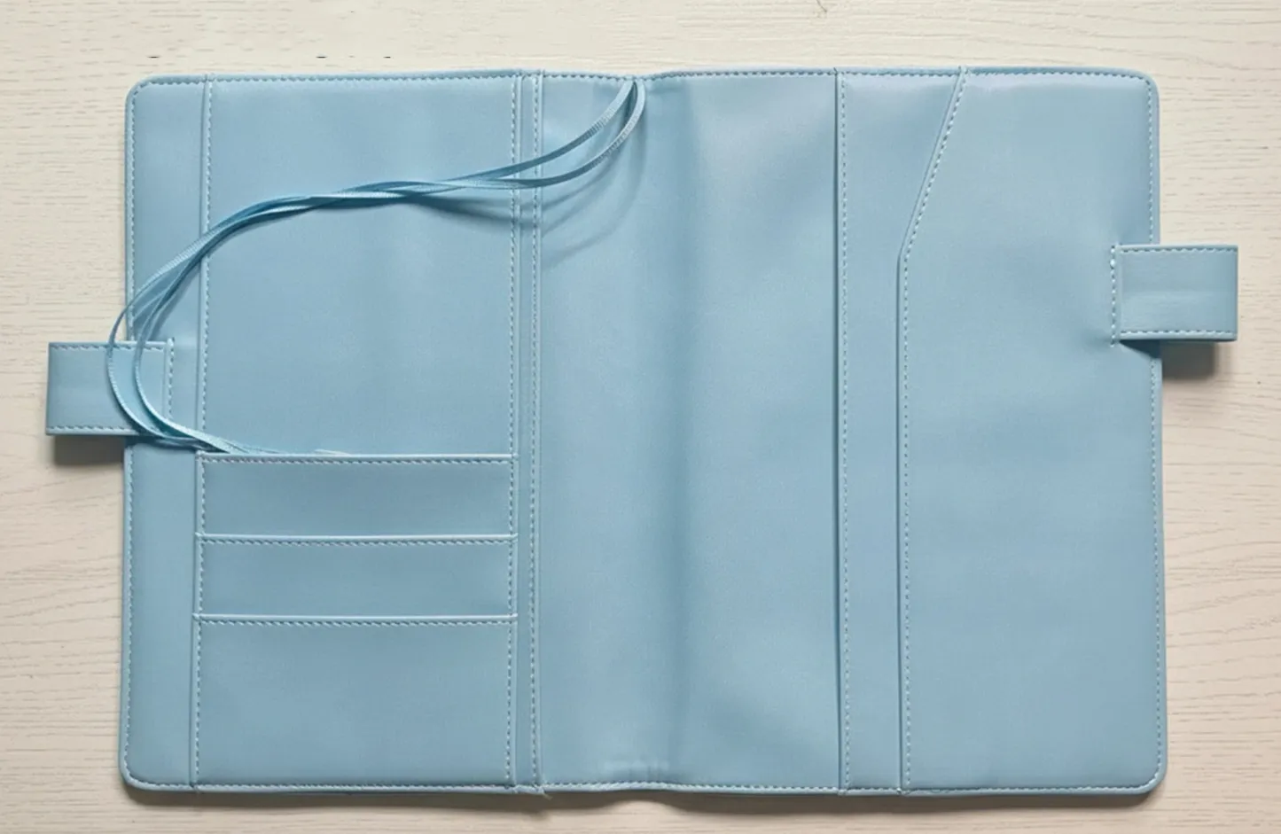 interior of handmade fabric planner cover  with card slots and pocket on white background