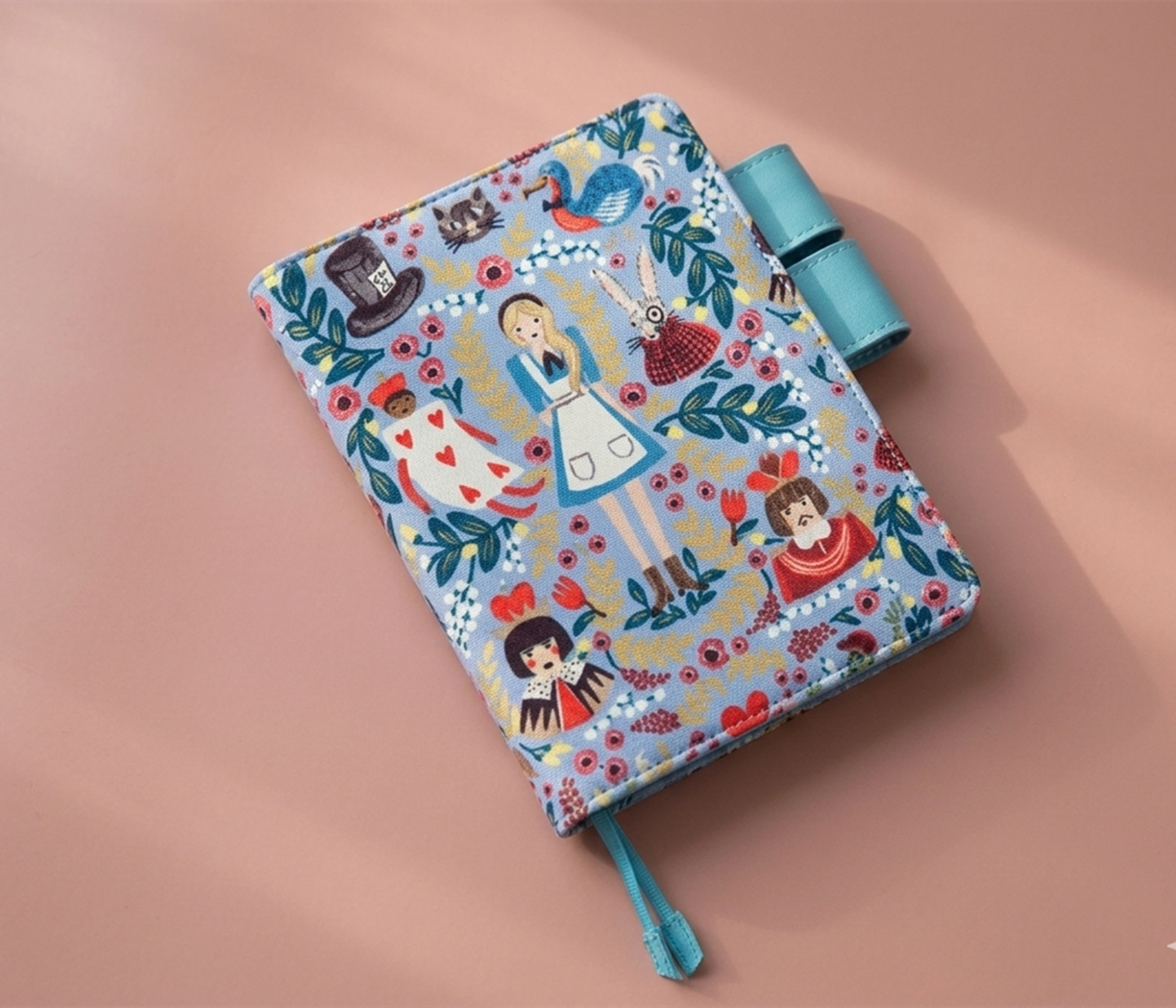 Close-up detail of high-density Alice in Wonderland character  on handcrafted journal sleeve.