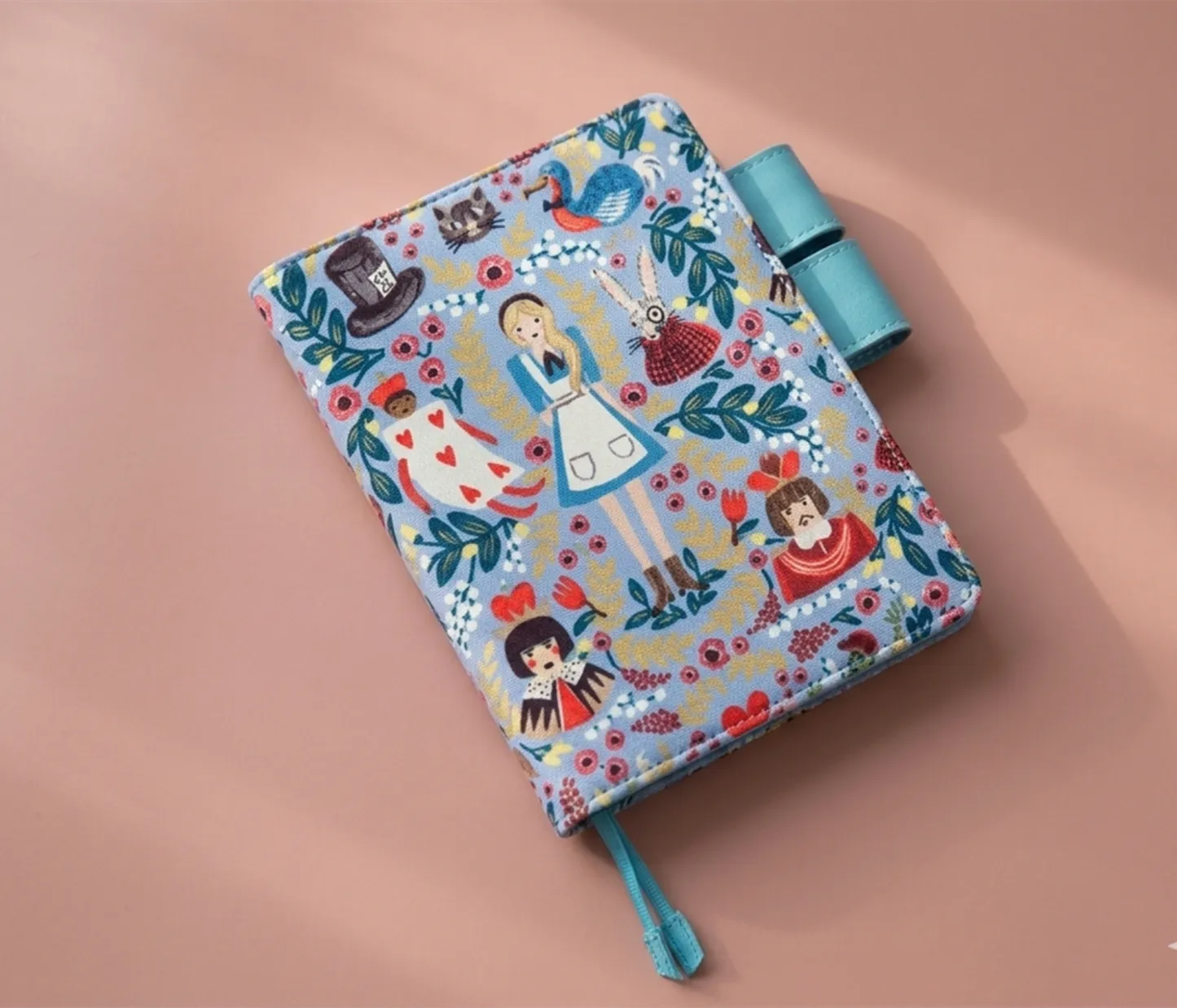 Close-up detail of high-density Alice in Wonderland character  on handcrafted journal sleeve.
