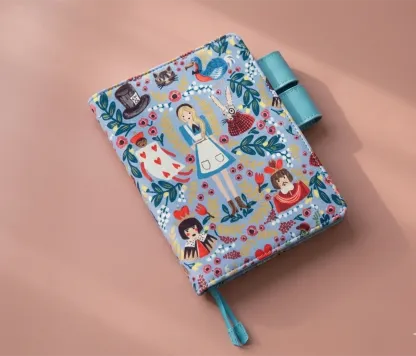 Close-up detail of high-density Alice in Wonderland character  on handcrafted journal sleeve.