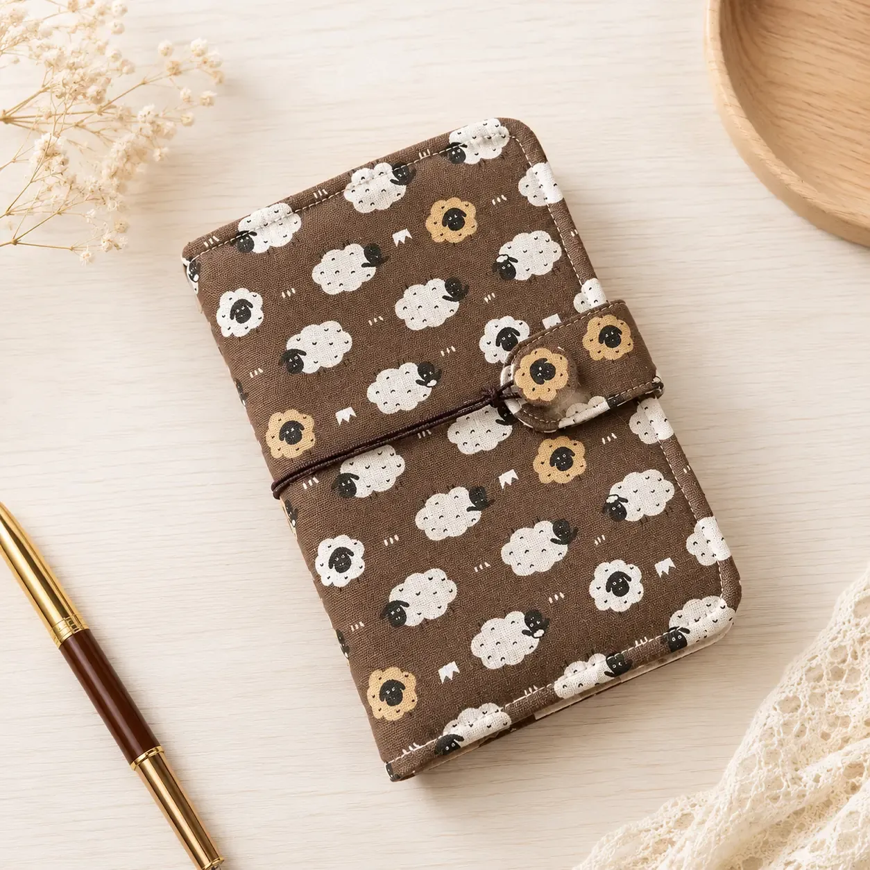 Sheep print fabric savings binder cover with cord closure front view