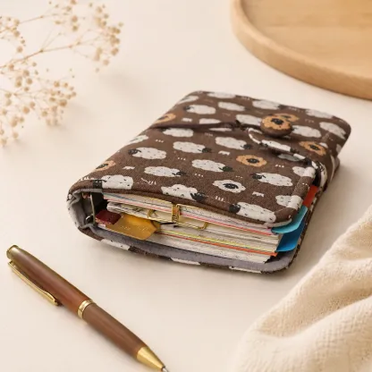 Sheep print 6-ring savings binder filled with planner inserts and pockets