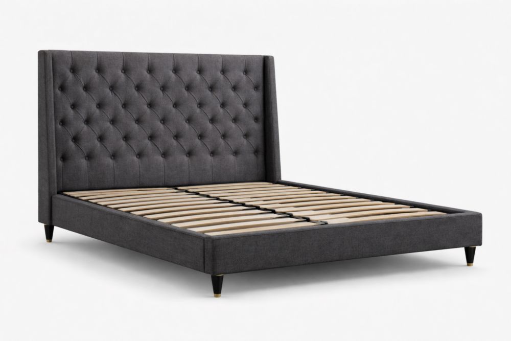 Dark gray upholstered bed frame with a tufted headboard