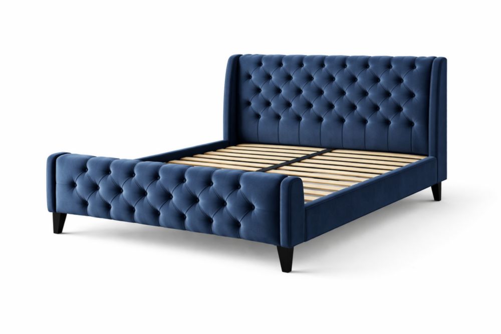Blue velvet upholstered platform bed with button-tufted detailing