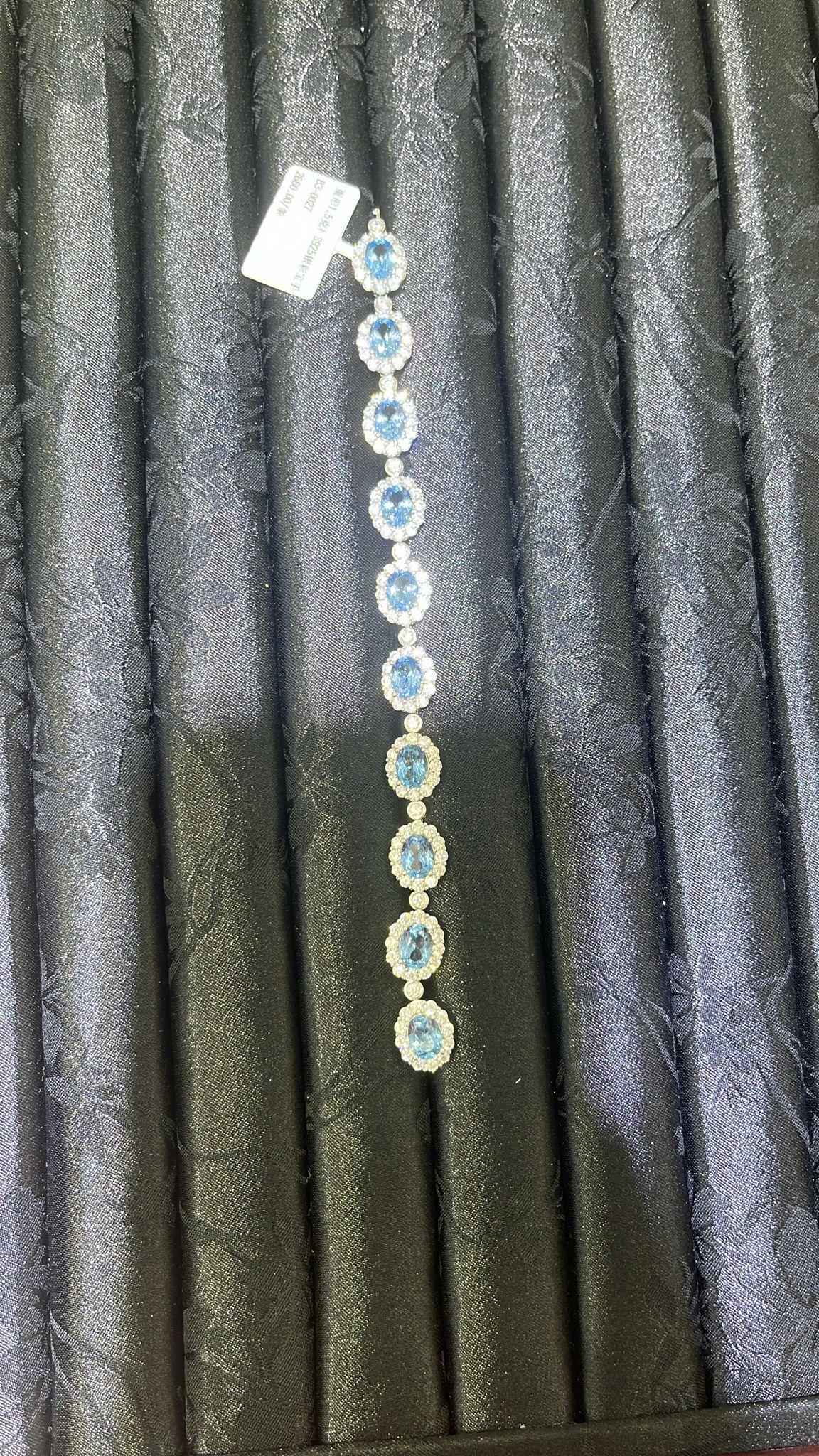 H16 1.5CT LAB GROWN LAKEBLUE SWANEGG SURR MOS DIA BRACELET