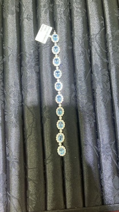H16 1.5CT LAB GROWN LAKEBLUE SWANEGG SURR MOS DIA BRACELET