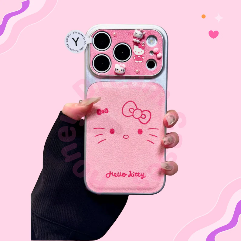 ピンクのハローキティレザーiPhoneケース、リボンハローキティiPhone 17 16 15 14 13 Pro Maxケース、ハローキティiPhoneカバーケース、彼女へのギフト