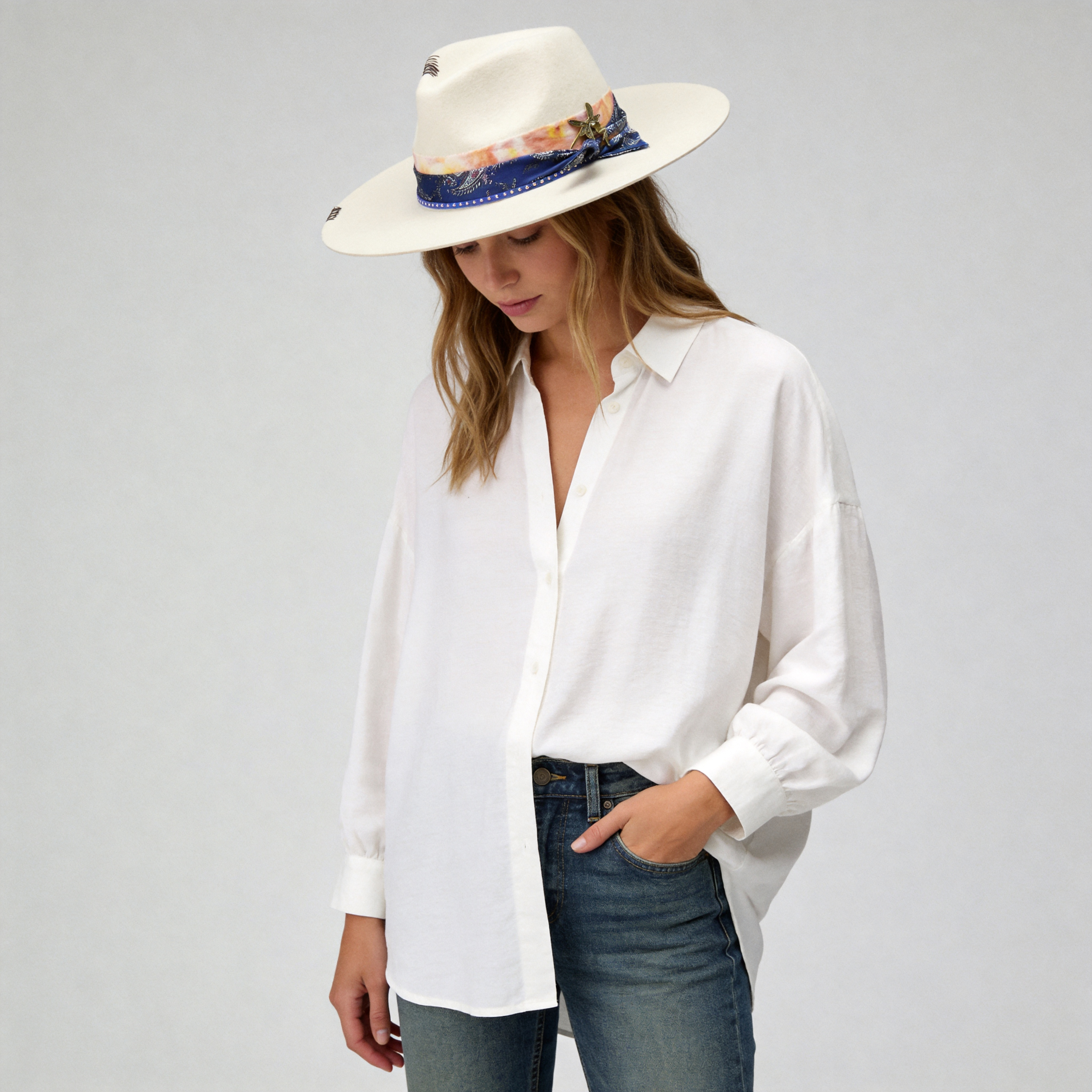 Elegant Off-White Hat with Delicate Metal Accent