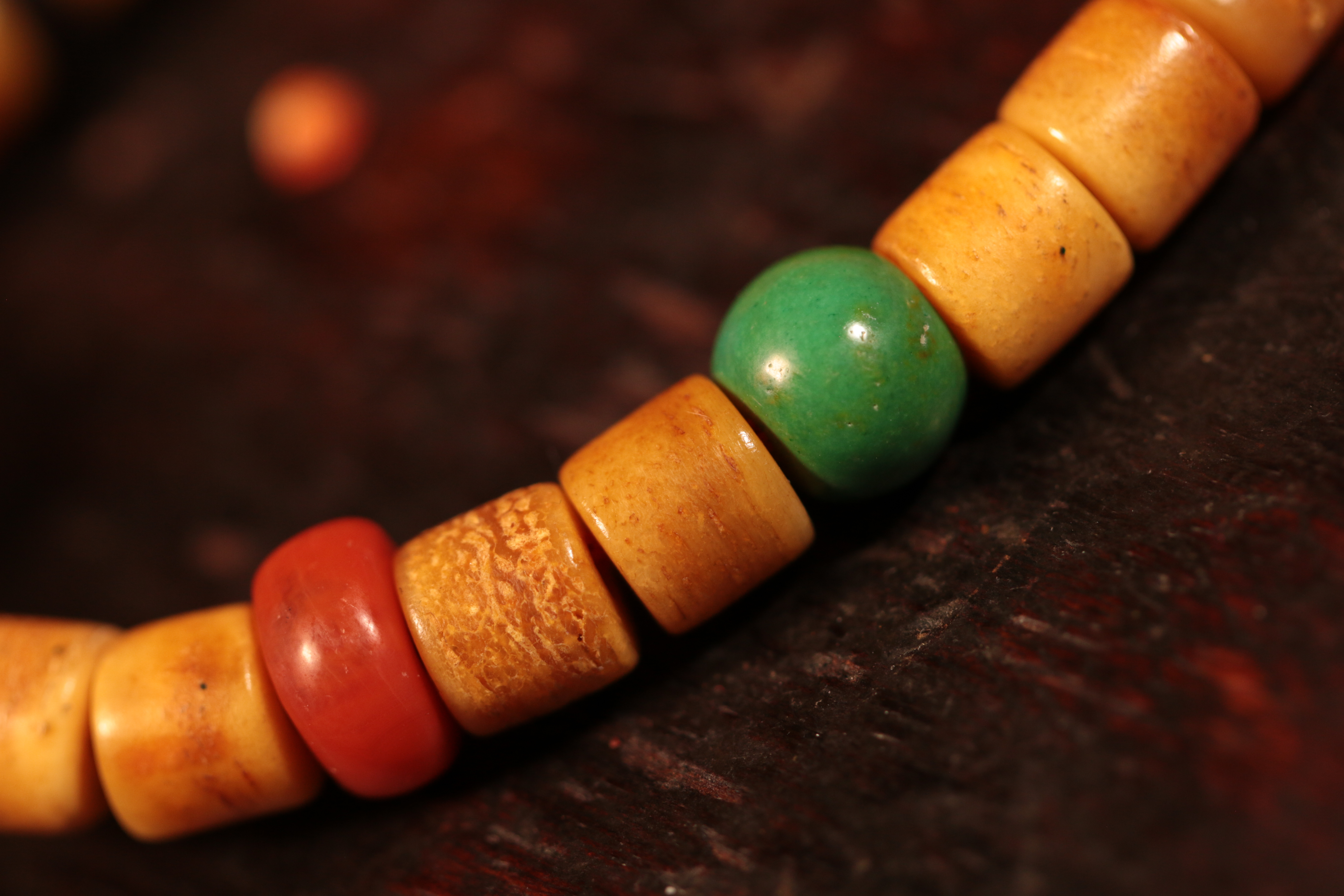 Linggu, holding a Heaven and Earth Dzi Bead bracelet.（Unique ID:cp-1-6428）