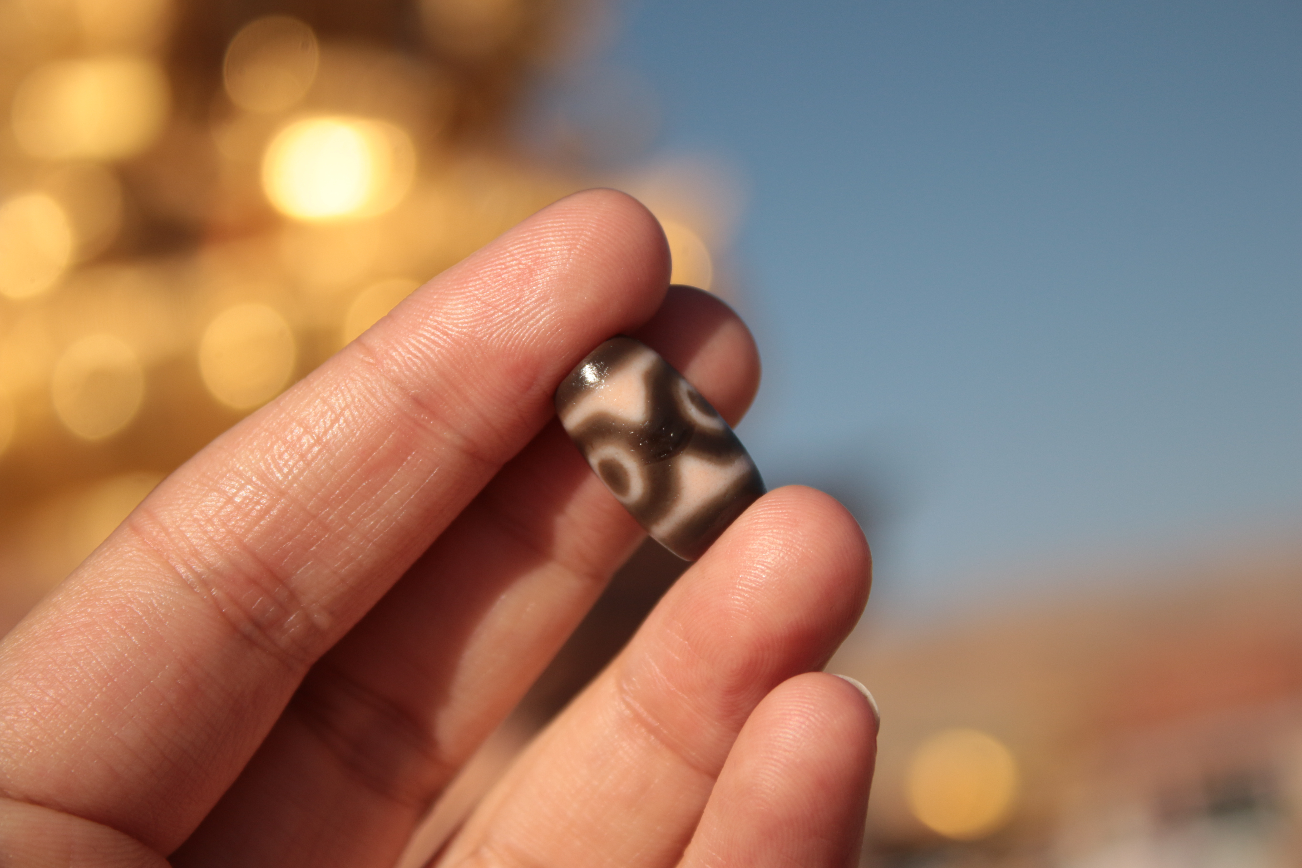 A Tibetan heirloom: Cinnabar Panda Three-Eyed Dzi Bead（Unique ID: tz-3-2370）