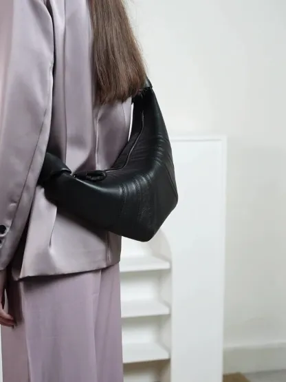 法國小衆頭層小羊皮可頌包斜跨慵懶感牛角包真皮單肩斜跨餃子包女