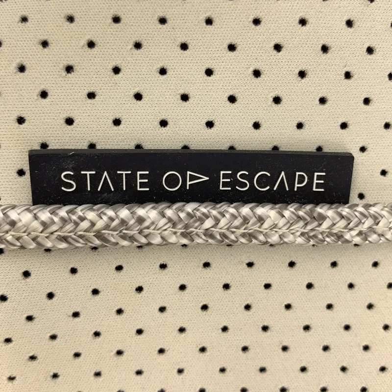 STATE OF ESCAPE / ステイトオブエスケープ | ポーチ付き パンチング トートバッグ |