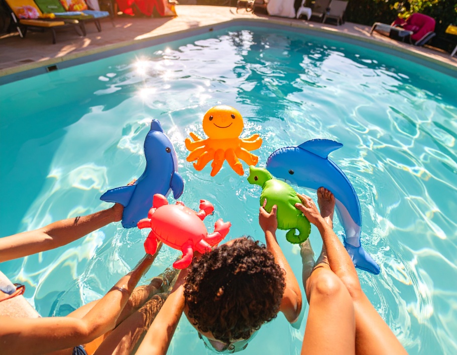 Firefly-A-pool-scene-with-young-adults-interacting-with-the-Mini-Inflatable-Sea-Toy-Set-hold-302143